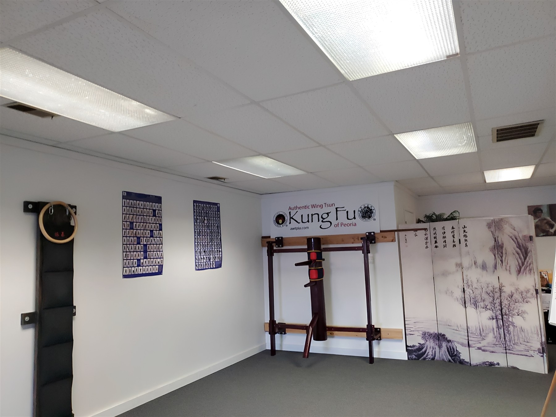 The Peoria training space with its traditional wooden dummy